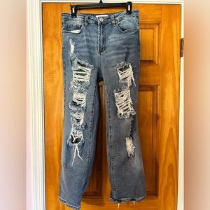 A pair of ripped denim size seven jeans, from the brand Almost Famous.